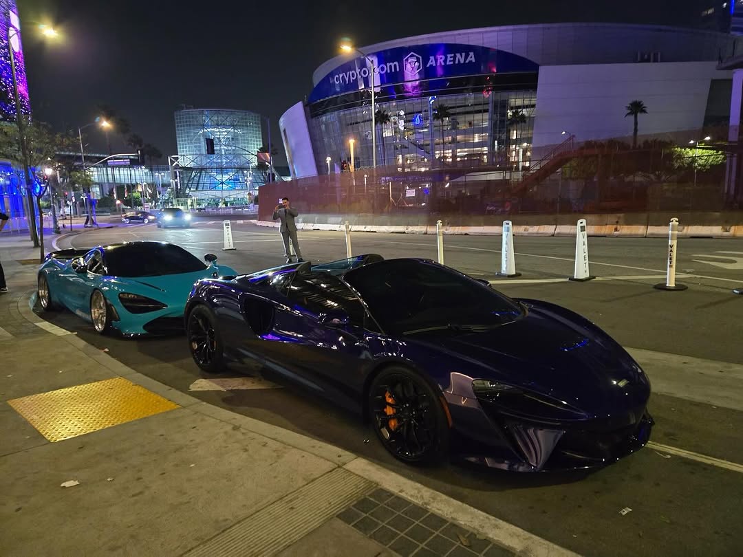 Valet staging beside luxury vehicles near Crypto.com Arena in Downtown Los Angeles